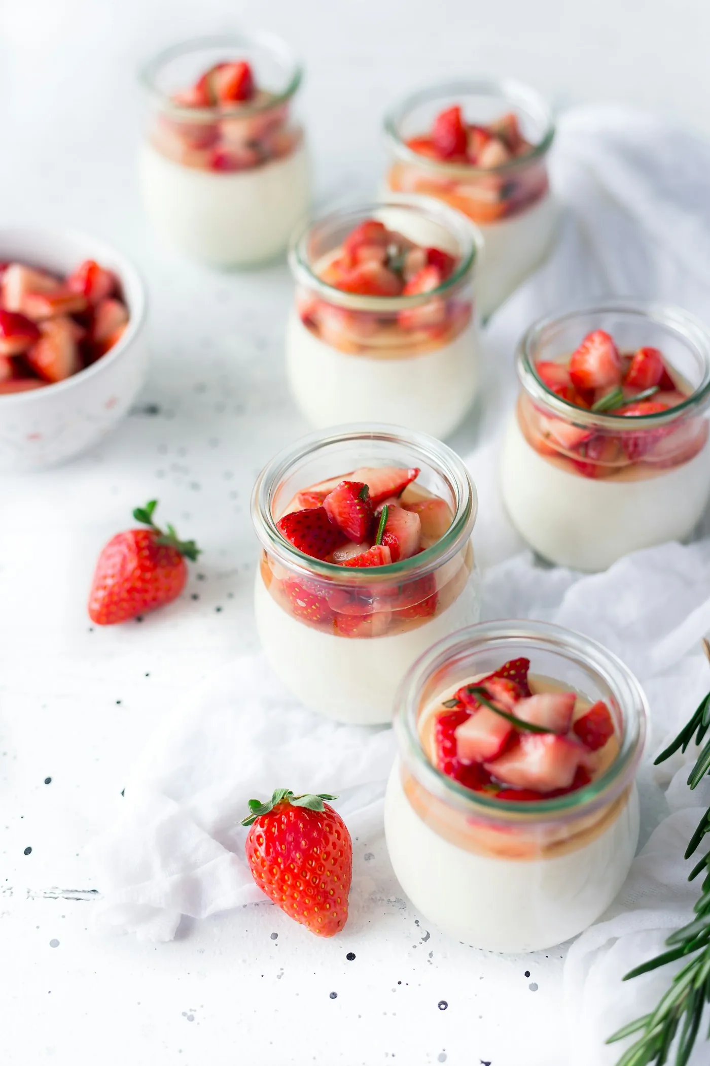 Strawberries and cream desserts in glass jars