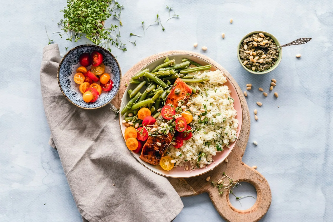 A colorful plate of salmon, couscous, and green beans